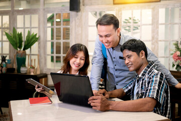 Portrait of multiethnic business colleagues discussing a business project plan during a meeting