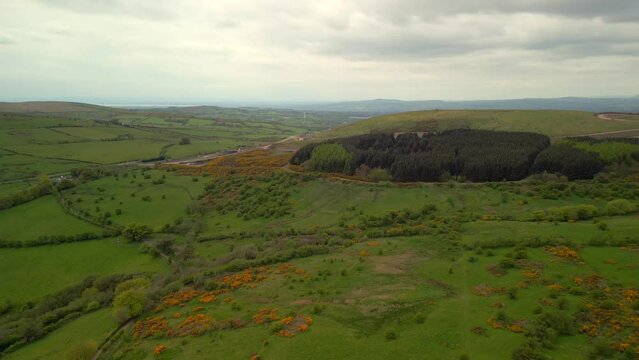 Aerial shot of Cavehill, Belfast on a spring day.

Produced in 4K, 60fps and in Rec709 color space.

The camera moves forward over the mountain fields on a sunny spring day.
