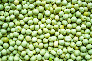 Background of a green peas grains close up. Food pattern.