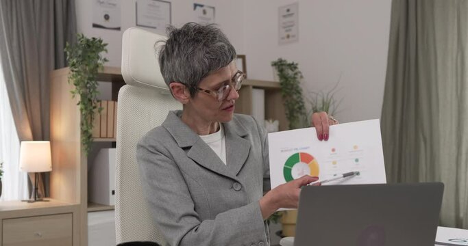 Mature woman share statistics have consultation via video call office