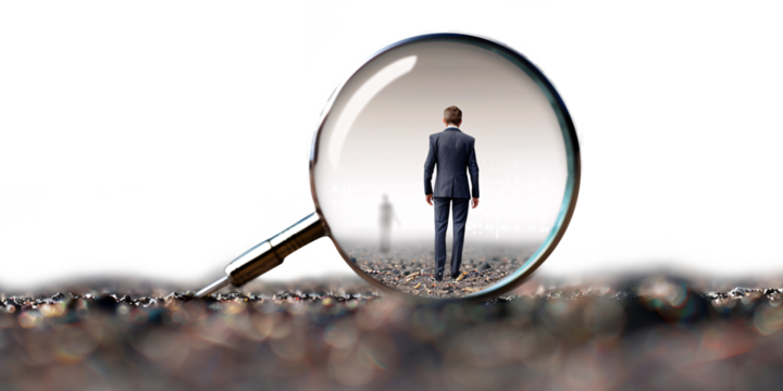 Businessman looking through a magnifying glass. Selective focus. transparency background