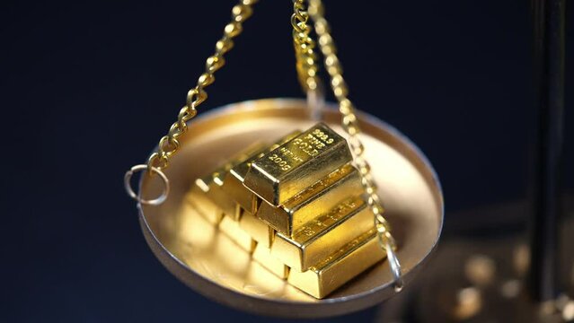 Gold price and value in both arms scales