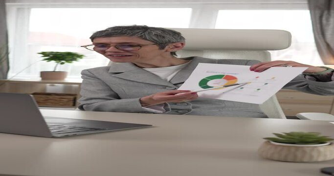 Mature woman share statistics have consultation via video call office