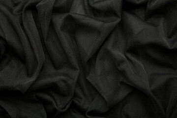 Black linen fabric texture. Black cloth textile background. Draped raw organic cloth black pattern,...
