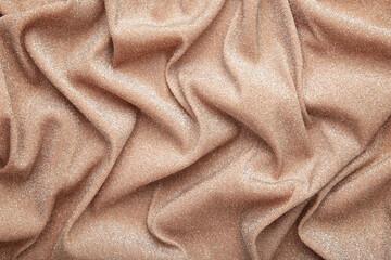 Beige brilliant texture. Cloth textile background. Top view