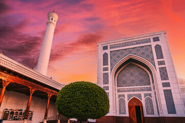 new Islamic Masjid Minor Mosque in Tashkent in Uzbekistan on background of the dramatic red sunset sky