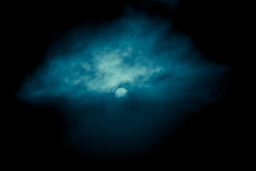 Night sky with dark clouds and the full moon. Halloween background.