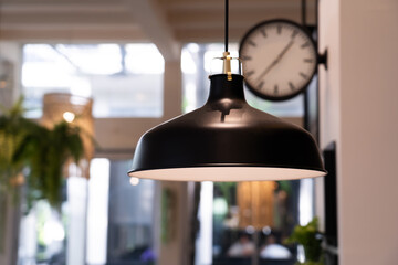 Black vintage lamp in restaurant The decoration of the shop has a warm atmosphere