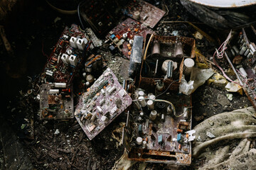 Parts of microcircuits and electronic circuits of a computer in the trash.