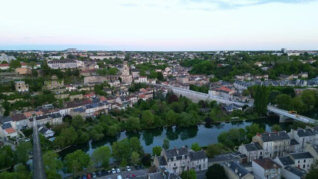 Poitiers cityscape with Clain River, France. Aerial forward and sky for copy space