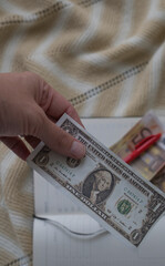 close-up of a hand counting paper money