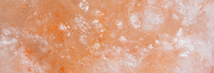 Himalayan salt texture, macro, copy space. Natural salt background. Himalayan coral pink rock salt,...