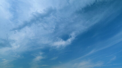 Cirrus or feather clouds against a blue sky. Natural beautiful scene. Purity and serenity concepts....
