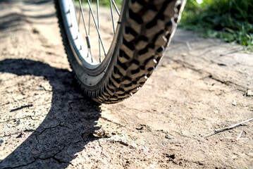 Fototapeta na wymiar Bicycle tire with high tread for a dirt road.