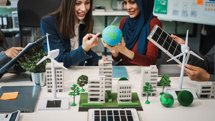Diverse team, middle-aged Asian businessman, Caucasian young businesswoman, Muslim hijab-wearing...