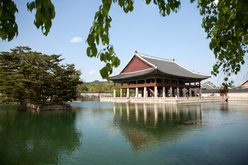 Naklejka premium View of the traditional wooden pavilion on the lake in the palace