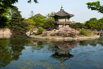Fototapeta premium View of the traditional wooden pavilion on the pond in the palace