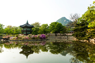 View of the traditional wooden pavilion on the pond in the palace