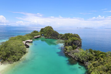 Aerial view of Rufas island with its lagoon in the middle located in Raja Ampat, West Papua