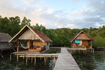 Fototapeta na wymiar View of typical bamboo houses in West Papua, Raja Ampat archipelago
