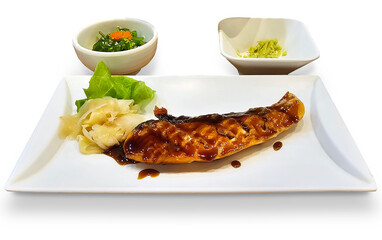 Delicious grilled mackerel on a white plate with pickled ginger and wasabi, accompanied by a fresh seaweed salad