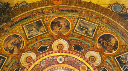 Fototapeta na wymiar Colorful Paintings of Buddhist Vihara on Ceiling of Gangaramaya Temple, Colombo, Sri Lanka.