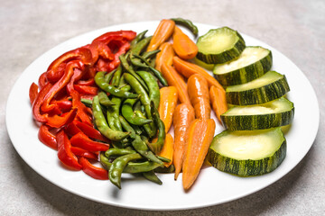 Cooked vegetables. Steamed zucchini, green bean, carrots, pepper. Low calorie diet concept.