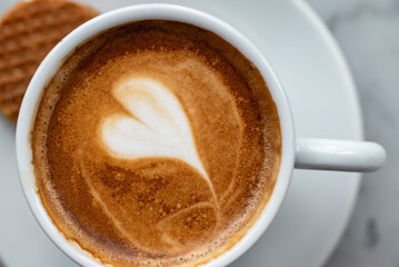 Top view of a cup of coffee with milk. 