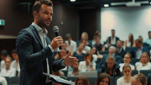 speaker speaking in front of the audience