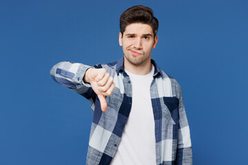 Young sad mad Caucasian man he wear shirt white t-shirt casual clothes showing thumb down dislike...