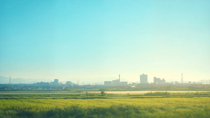 Distant city skyline at sunrise, Contrast of modern urban development and rural countryside in morning light landscape and fields