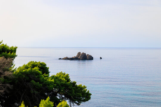 Coast and lonely rocks in the sea near Sinarades on the island of Corfu