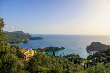 View in the evening under a blue sky over the bay and the sea at Paleokastrtitsa on the island of Corfu