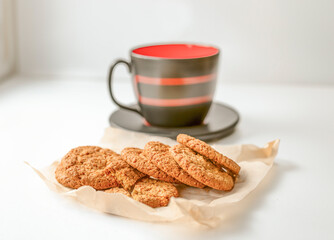 homemade cookies and mug on white table
