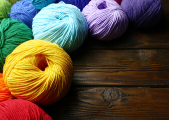Knitting yarn  balls on wooden table        