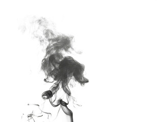 Wispy white smoke against a dark background