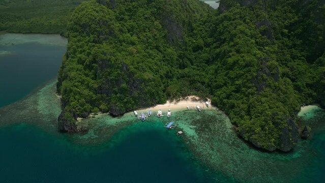 beach with boats on the island of the Philippines