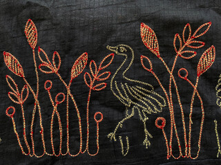 Thread embroidered peacock with leaves and flowers in black cotton silk fabric