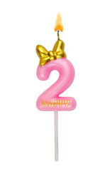 Pink birthday candle with gold bow isolated on white background. Number 2.	