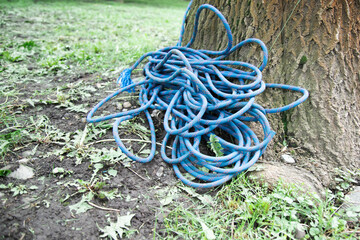 climbing equipment on the ground. climbing Rope rolled up , copy space