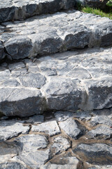 Stone flat steps in the garden. Stone slab - plates of natural stone.