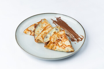 Homemade French crepes filled with chocolate cream.