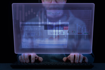 Close-up of a man's hands on a laptop keyboard and virtual screen with business, banking and...