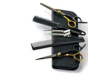 Composition with scissors and other hairdresser's accessories on white background, top view