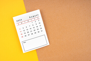 Calendar page for August 2024 on a yellow and brown color