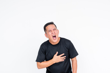 An Asian man in his middle years appears distressed, clutching his chest and showing symptoms of an...