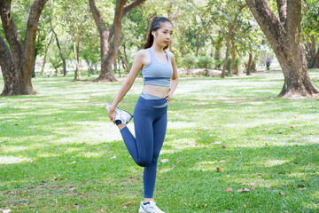 Woman exercising in the park exercise concept health care.
