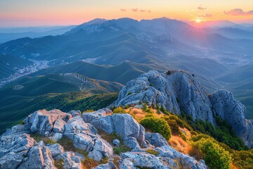 Sun Setting Over Mountain Range
