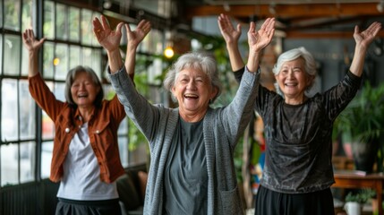 Fototapeta premium Joyful gathering of three elderly women celebrating with arms raised in a cozy cafe, evoking feelings of friendship and happiness, warm tones dominate.