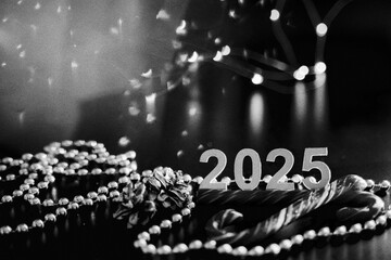 black and white New Year's Christmas photo card with numbers 2025, beads, garlands, pine cones,...
